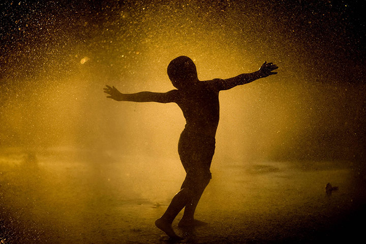 24 hours in pictures: A boy in a fountain in Israel
