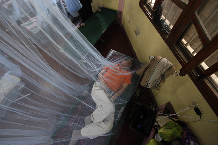 24 hours in pictures: A patient suffering from dengue fever 