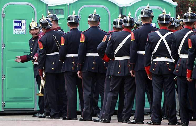 24 hours in pictures: Soldiers outside portable toilets during Independence Day 