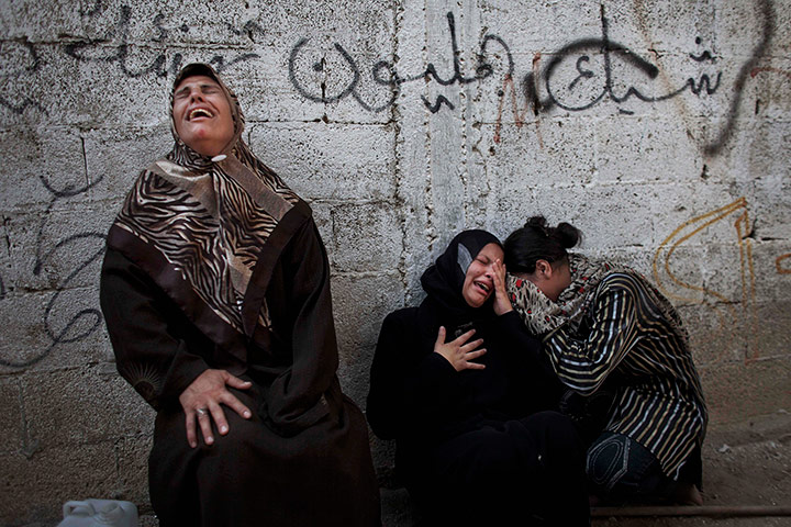 24 hours in pictures: Relatives mourn in Beit Hanoun, Gaza Strip, during the funeral of militant Qasem al-Shembari