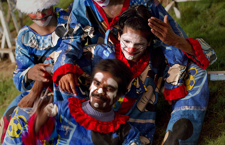 Jan Baz Circus: Clowns pose for a group portrait between performances