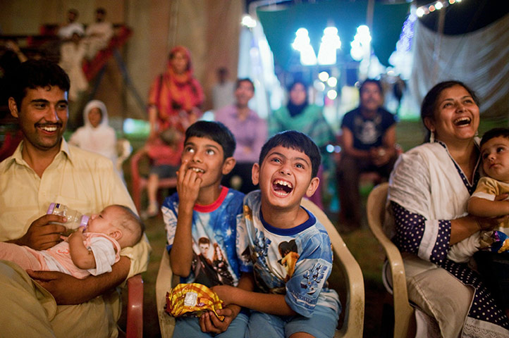 Jan Baz Circus: Children laugh while watching performers
