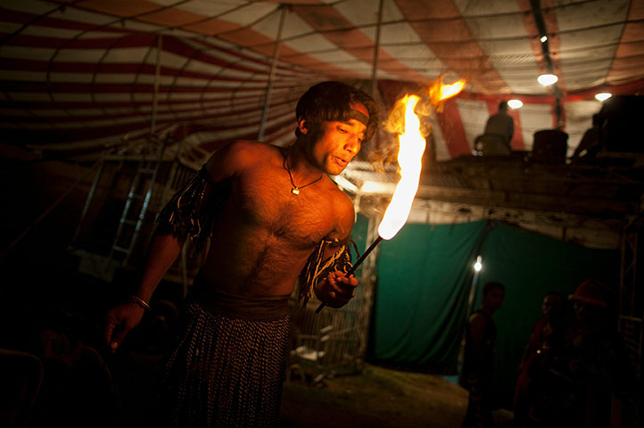 Jan Baz Circus: A fire-eater warms up before his act