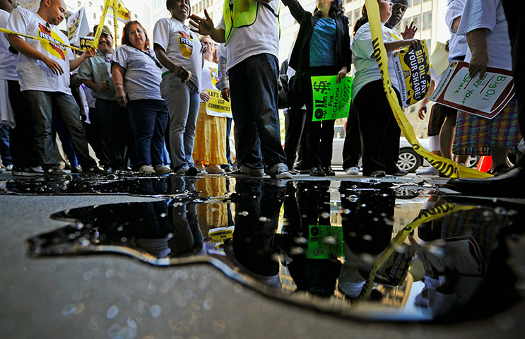 24 hours: Demonstrators dump black slime in front of Occidental Petroleum Corporation