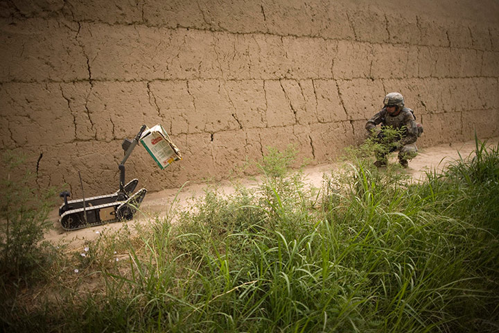 24 hours: A bomb disposal robot brings a carton for inspection, Kandahar, Afghanistan