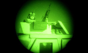 An American soldier seen through night vision equipment in Afghanistan's Paktia province