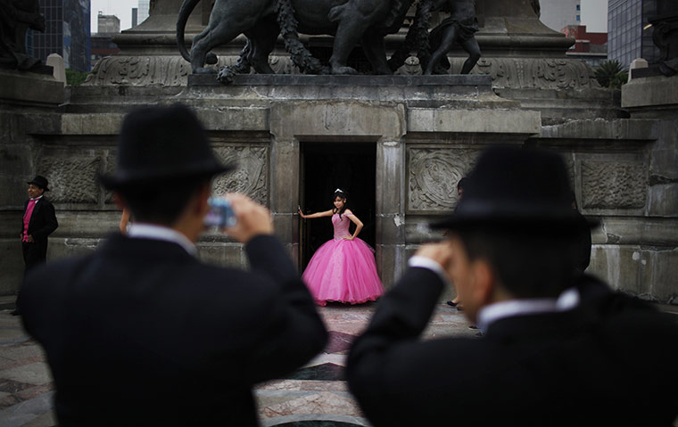 24 hours: A girl poses for photos in celebration of her 15th birthday in Mexico City