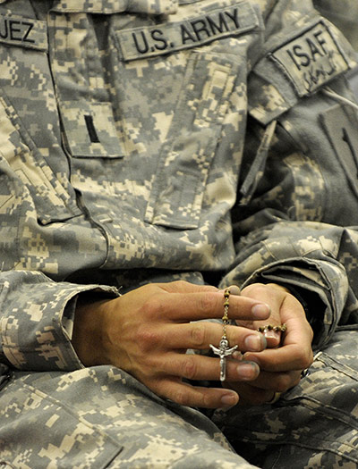 Afghanistan: 12 April 2009: A US soldier from 1st Infantry Division holds a rosary