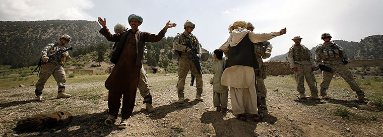 Afghanistan: 7 May 2008: Afghan men are searched before attending a shura