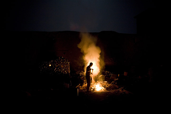 24 hours in pictures: Arghandab Valley, Afghanistan: US soldiers burn rubbish at COP Nolen