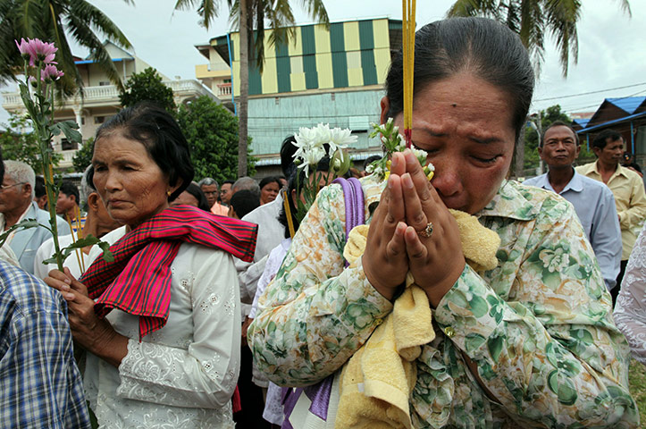 24 hours in pictures: Phnom Penh, Cambodia: Family members and relatives of Khmer Rouge victims