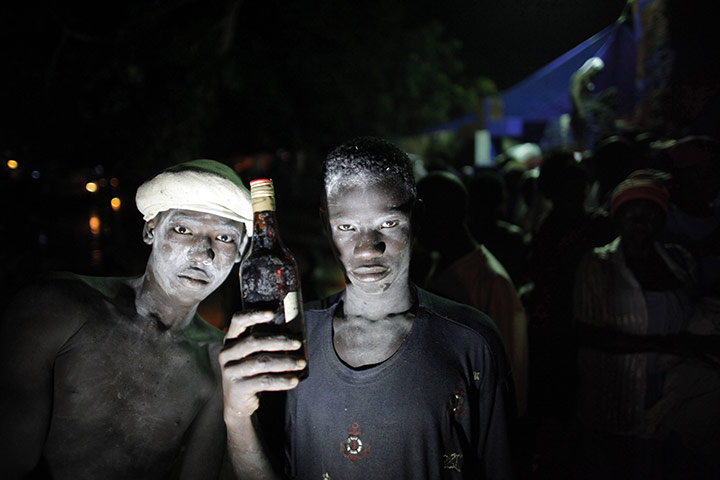 Voodoo in Haiti: Voodoo believers pose for a picture during a mass ritual