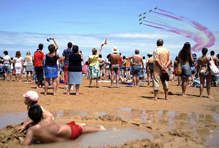 24 hours in pictures: Patrulla Aguila fly over San Lorenzo beach 