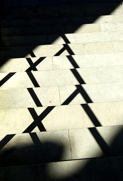 Angles: Shadows form crosses on the steps of Coventry Cathedral