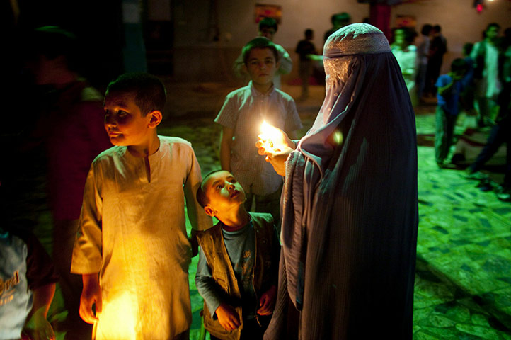 24 hours in pictures: shiites celebrate the birthday of the imam muhammad al-mahdi