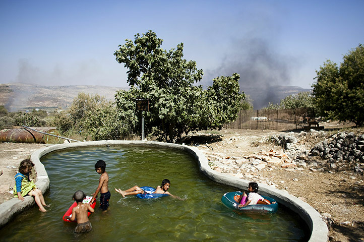 24 hours in pictures: Jewish settler children play in Givat Ronen, West Bank