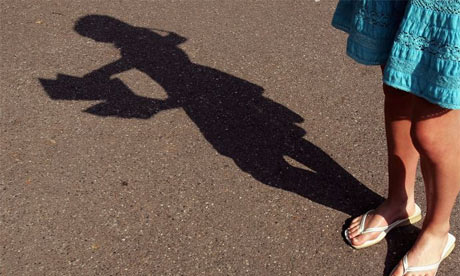 Shadow of a reading woman