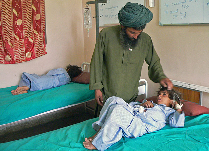 Sangin incident: An Afghan man talks to his wounded child