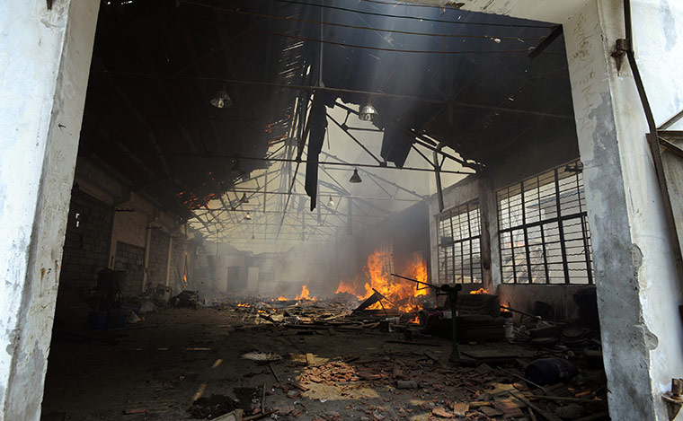 china factory explosion: a fire burning at the explosion site