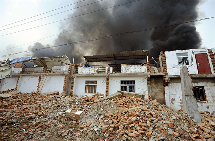 china factory explosion: Damaged houses are seen after the explosion 