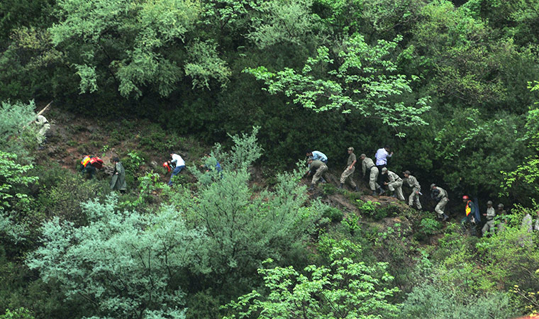 Plane crash in Pakistan: Rescue workers climb Margalla hills near the crash site