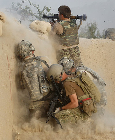 24 hours in pictures: Arghandab Valley, Afghanistan: A soldier fires a rocket propelled grenade