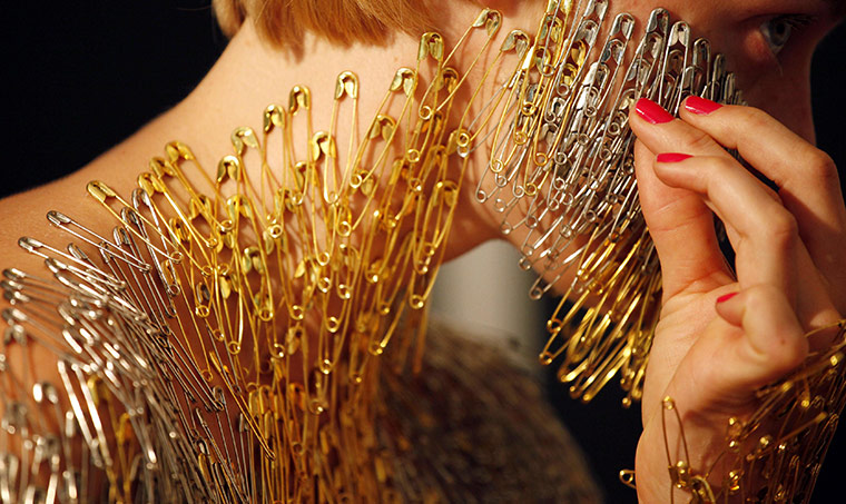 24 hours in pictures: Sao Paulo, Brazil: Artist Lucy McRae puts safety pins on her body