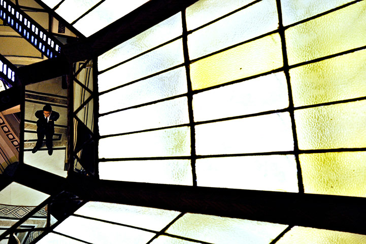 24 hours in pictures: Shanghai, China: An employee of the Peace Hotel