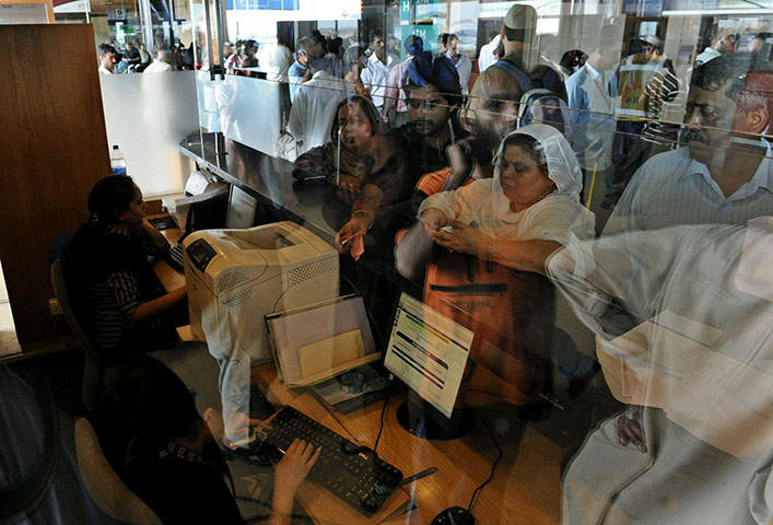 Plane crash in Pakistan: Pakistani relatives wait for information at the Airblue airline counter