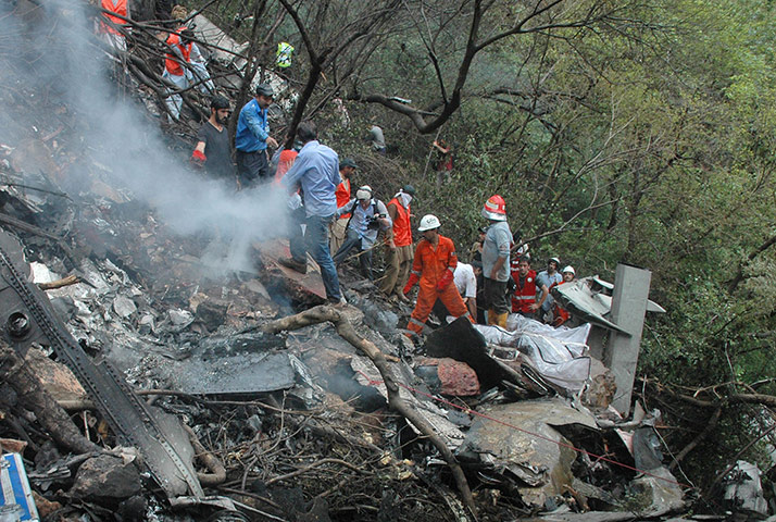 Plane crash in Pakistan: Rescue workers search for bodies amid the wreckage of a private airliner