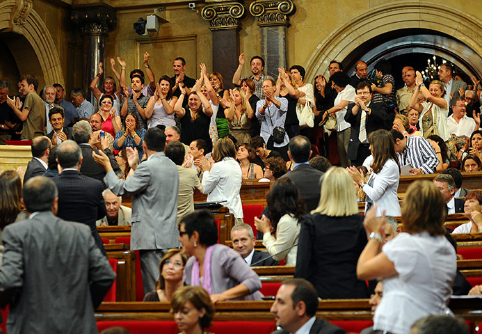 Bullfighting in Barcelona: 2010: People applaud after a vote to ban bullfights