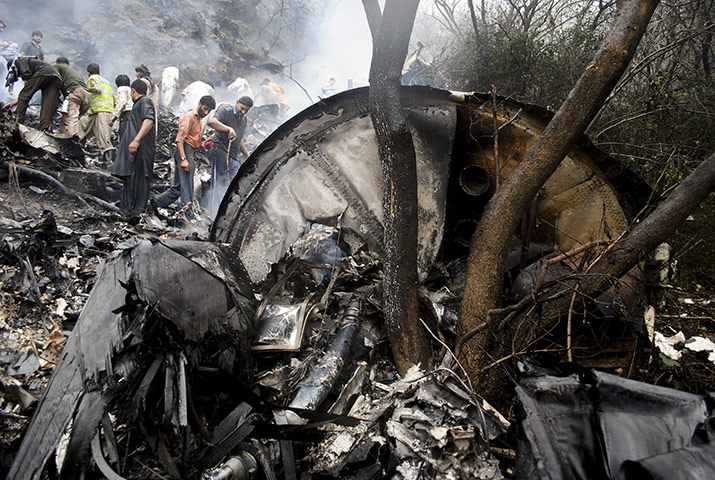 Pakistan plane crash: Pakistani rescue workers search for survivors amid the wreckage