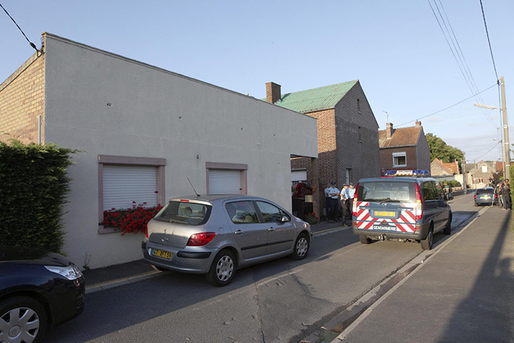 french infanticide case: French gendarmes at the house where the bodies of eight children were found