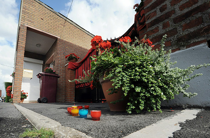 french infanticide case: Some candles  in front of the house in Villers-au-Tertre 