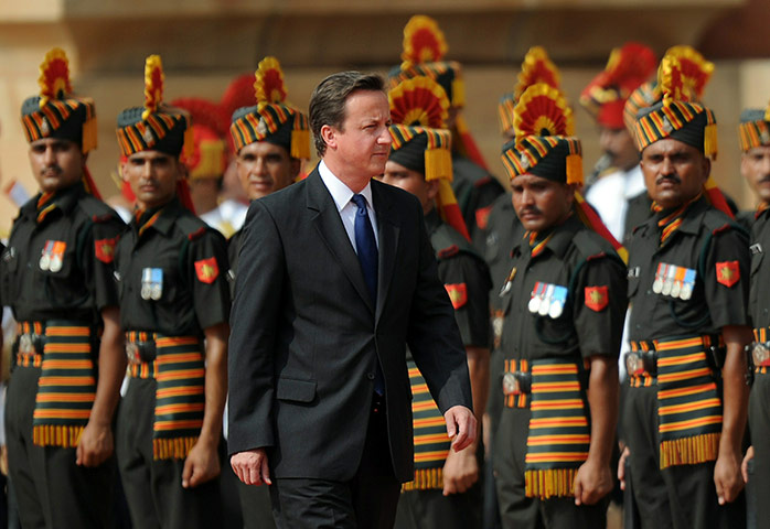 Cameron in India: David Cameron inspects an honour guard at the presidential palace 