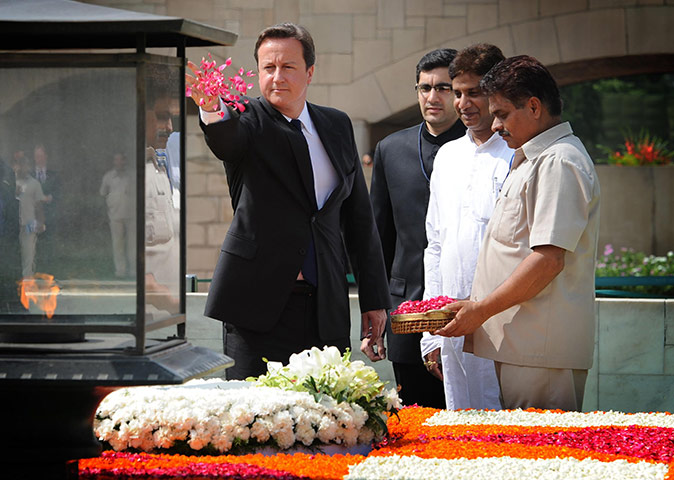 Cameron in India: David Cameron lays a wreath at the Gandhi Memorial at Rajghat in Delhi