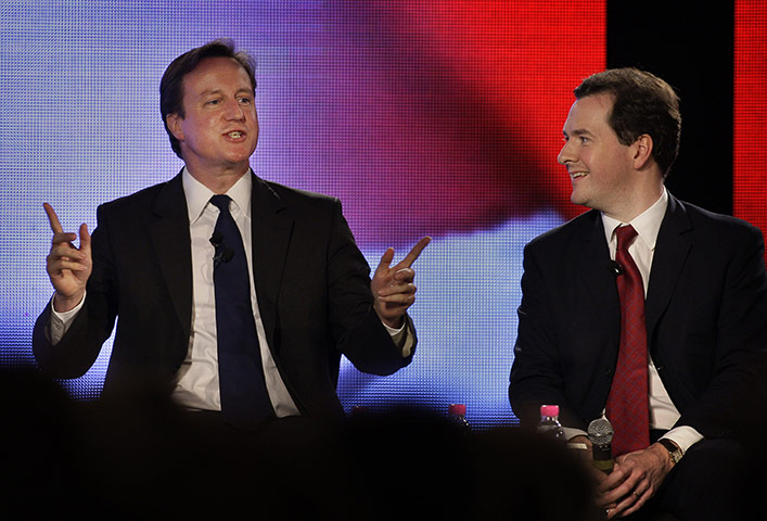 Cameron in India: David Cameron and George Osborne at a meeting with Indian businessmen