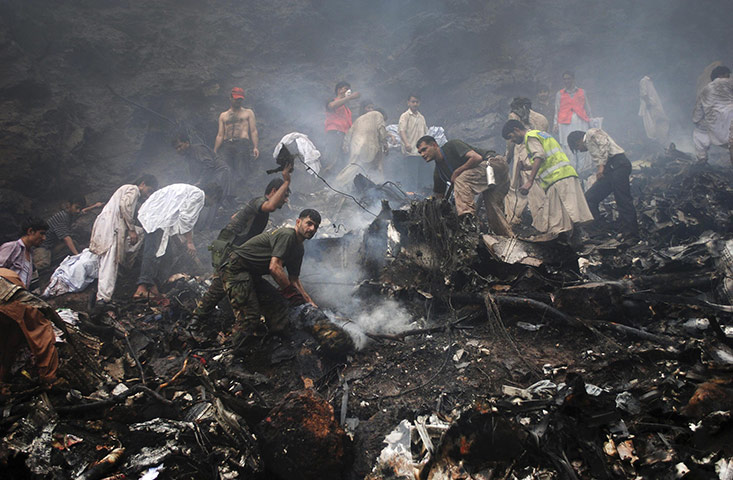 24 hours in pictures: Islamabad, Pakistan: The wreckage of an Airblue passenger plane