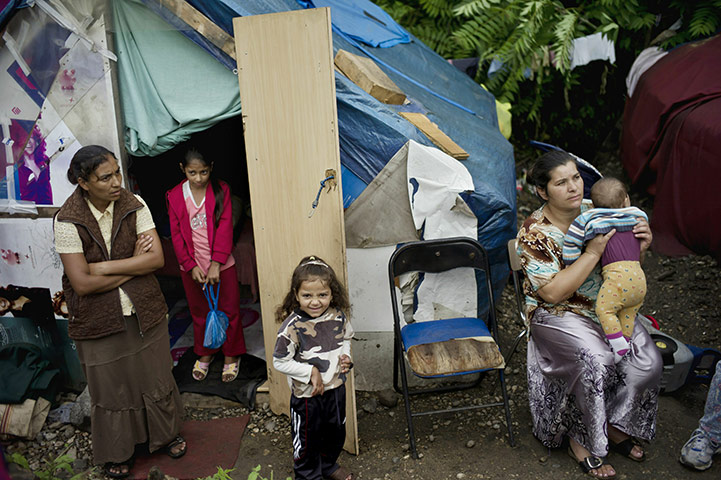 24 hours in pictures: Lyon, France: Women and children from the Roma community gather in a camp