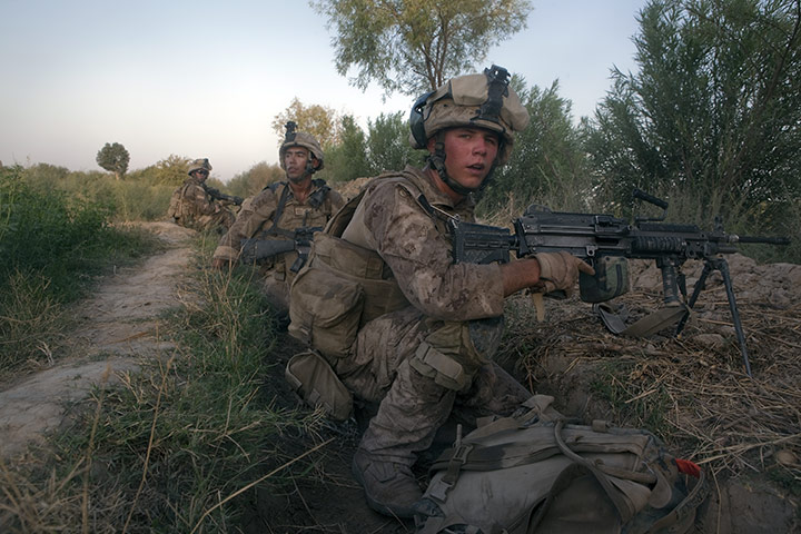 Sean Smith in Afghanistan: US marines take cover as they come under fire during a firefight in Garmsir, southern Helmand
