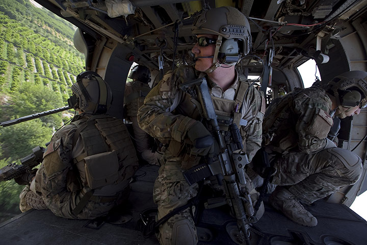 Sean Smith in Afghanistan: Medevac troops look out from their Pavehawk helicopter while heading to pick up casualties