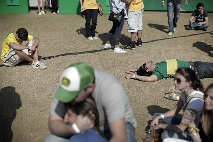 24 Hours in Pictures: Fans remain on the ground after Brazil lost in the World Cup