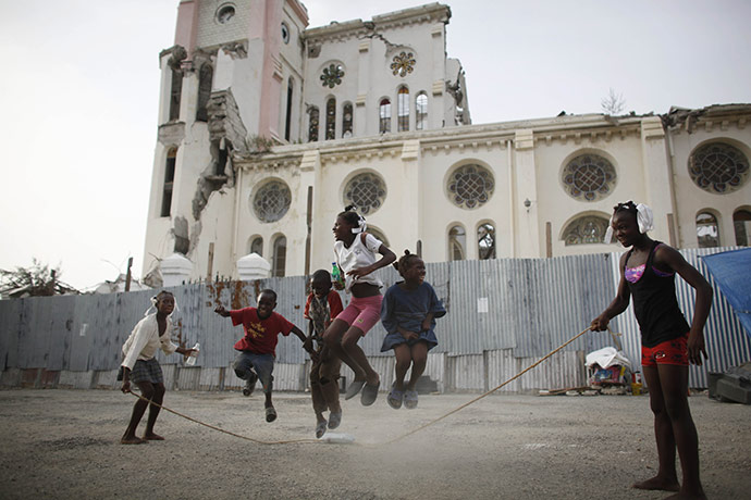 24 Hours in Pictures: Haitian children play near the Cathedral damaged by the earthquake