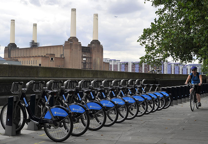 London cycle hire: A cyclist passes a newly installed line of bike bays near Battersea 