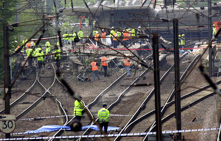 Potters Bar train crash: Emergency workers on the tracks after a train derailed at Potters Bar 