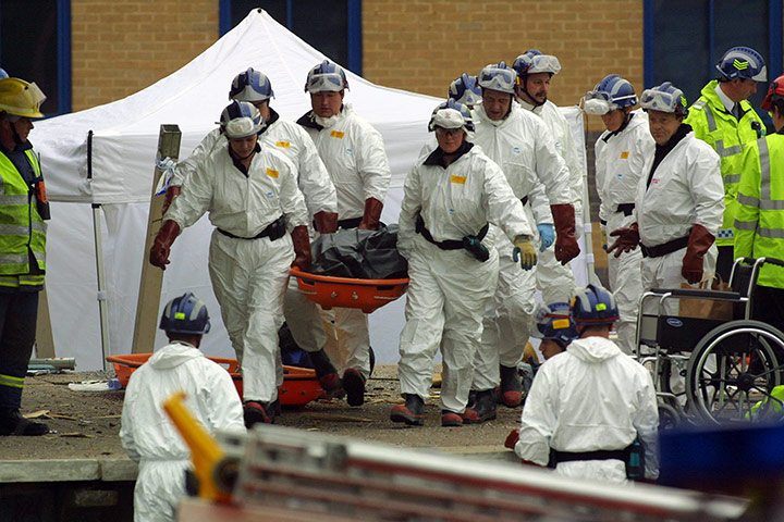 Potters Bar train crash: A body is removed from the wreckage at the rail crash at Potters Bar