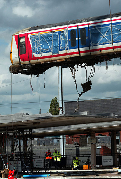 Potters Bar train crash: The wrecked train carriage is removed by crane