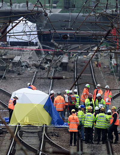 Potters Bar train crash: Transport police examine an area of track near the Potters Bar rail crash