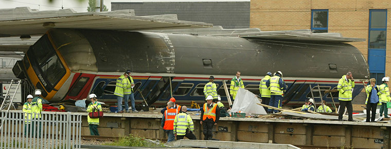 Potters Bar train crash: A carriage of the train involved in the crash on its side at the station