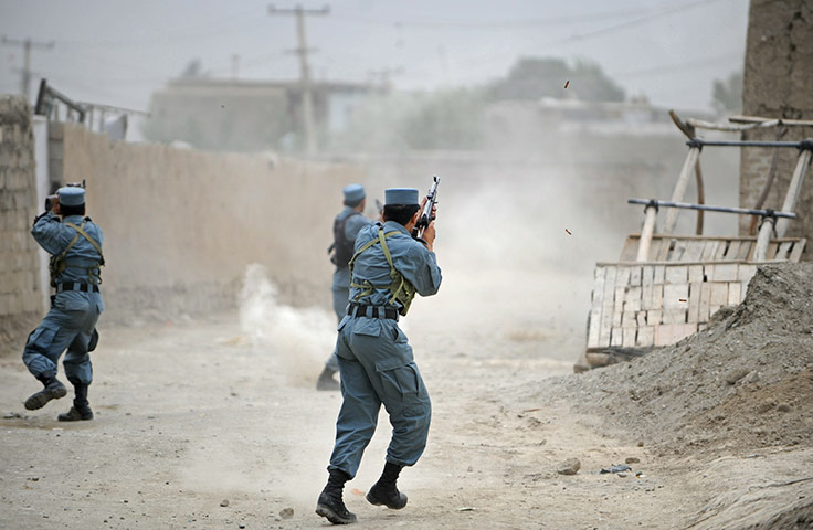 24 hours in pictures: Afghan policemen open fire
